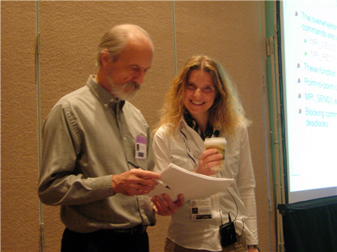 Two people chatting a presentation